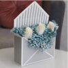 Envelope box containing gypsophelia and white roses for sale online by novo