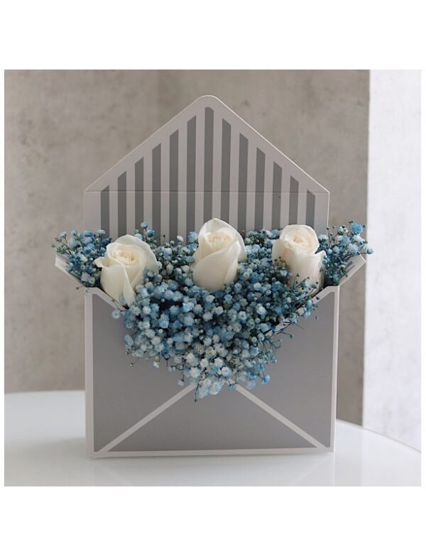 Envelope box containing gypsophelia and white roses for sale online by novo