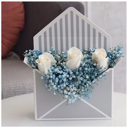 Envelope box containing gypsophelia and white roses for sale online by novo