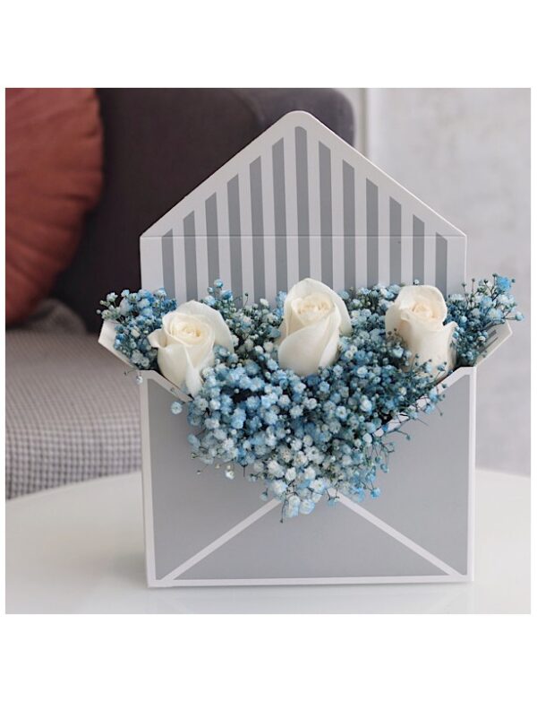 Envelope box containing gypsophelia and white roses for sale online by novo